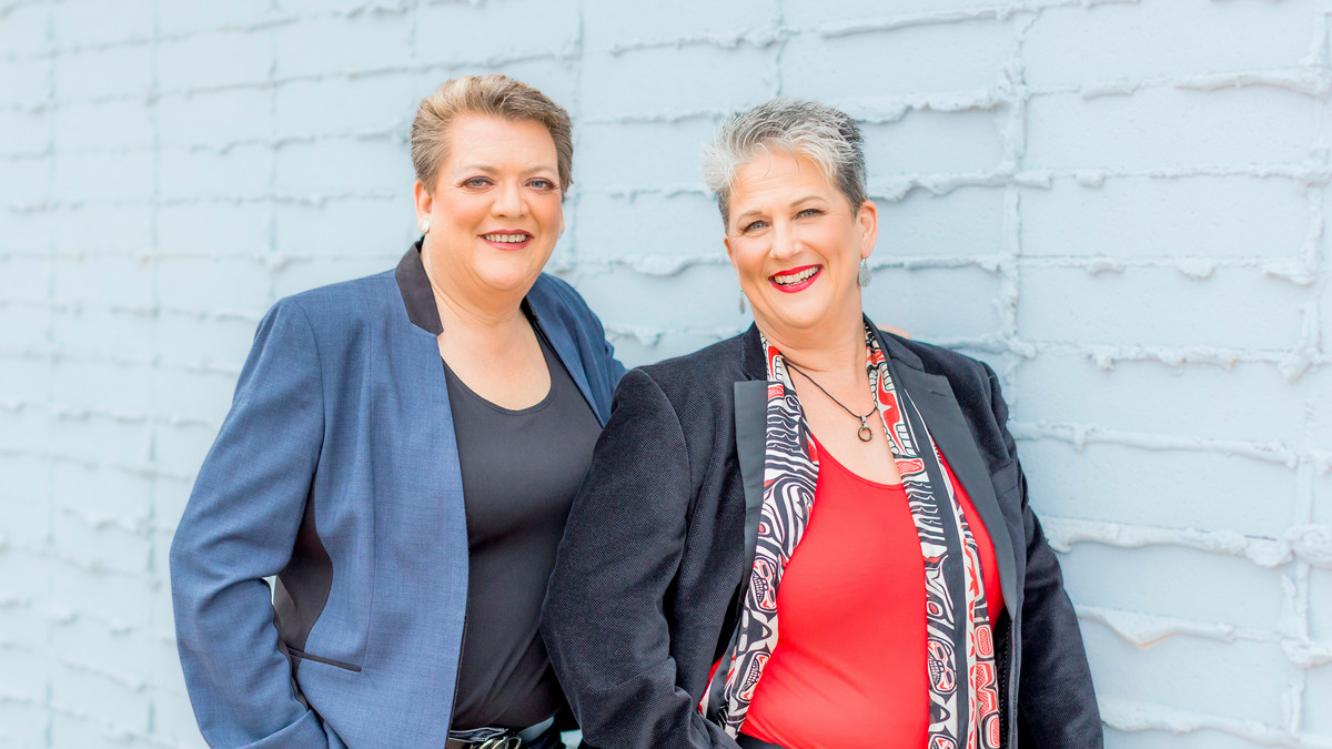 Image of Beth Mohr and Janet McHard in front of a white wall