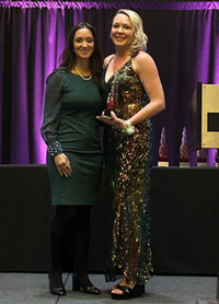 Michelle Dearholt presenting the award to Mia Petersen.