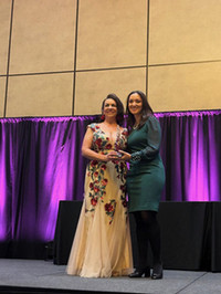 Roberta Ricci receiving her award from Michelle Dearholt.