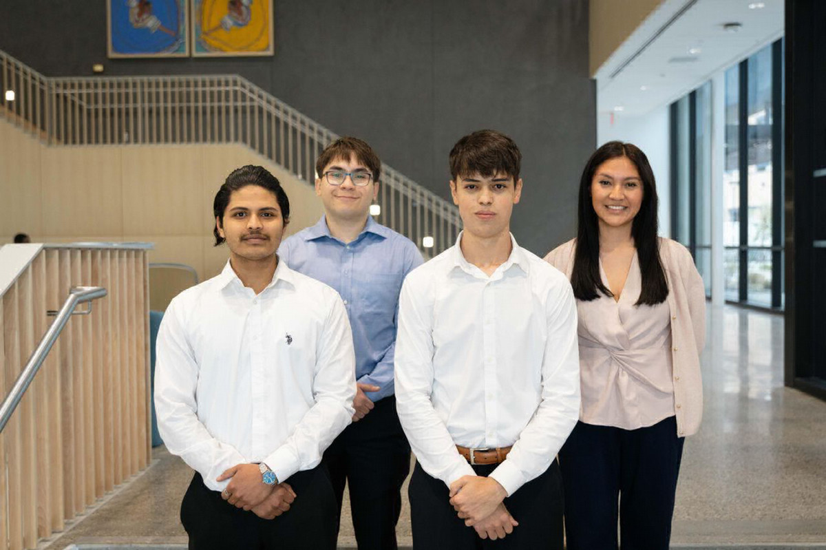 Group photo of student team. Left to right, Abhinav Punnakuzhy, Ethan Garcia, Abram Barrandey, and Taya Perales.