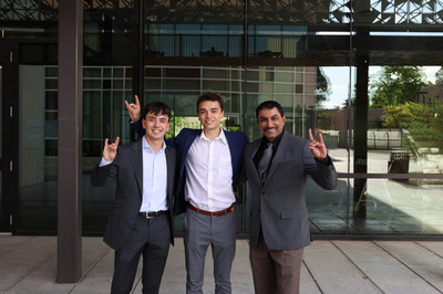 Image of David Davila, Samuel Landis, and Professor Subramanian Iyer doing a lobo pose in front of the McKinnon Center for Management.