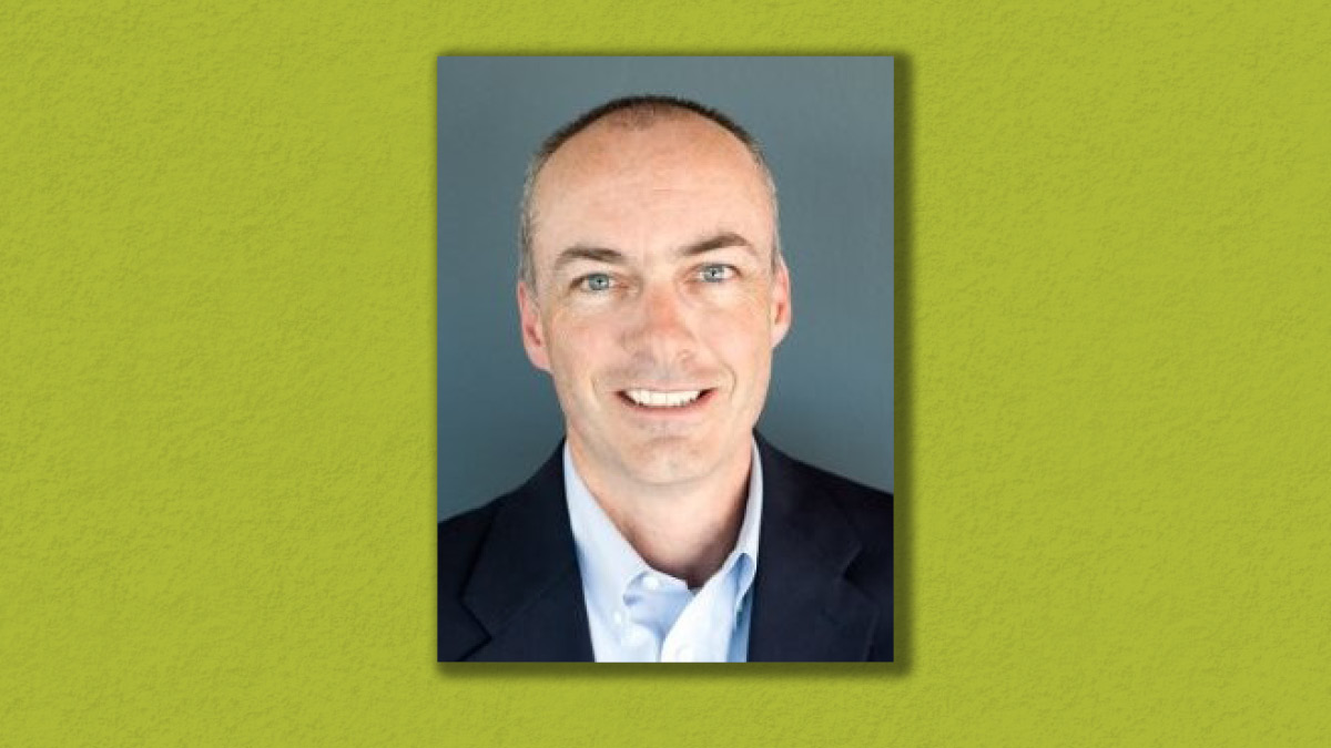 Graphic with image of Professor Craig White with a green background
