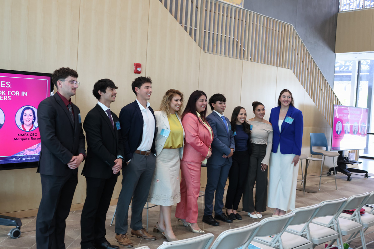Group photo of student with New Mexico State Treasurer Laura Montoya