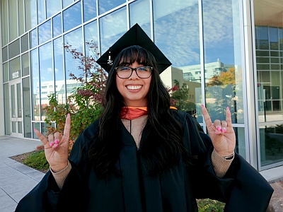 Staff helps students navigate the graduation ceremony at UNM Anderson