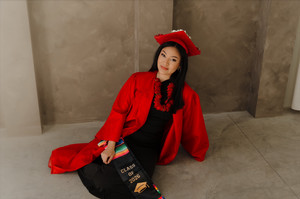 Taya Perales in graduation regalia.